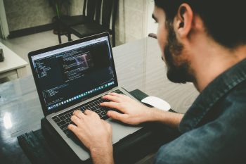 A man using a laptop.